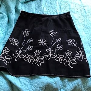 Black skirt decorated with flowers